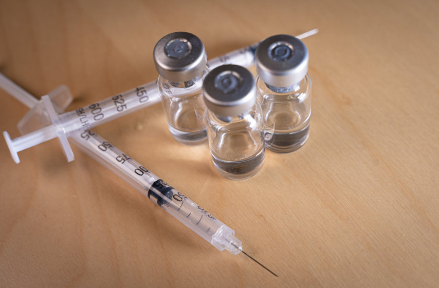 close up of medicine vials and syringes