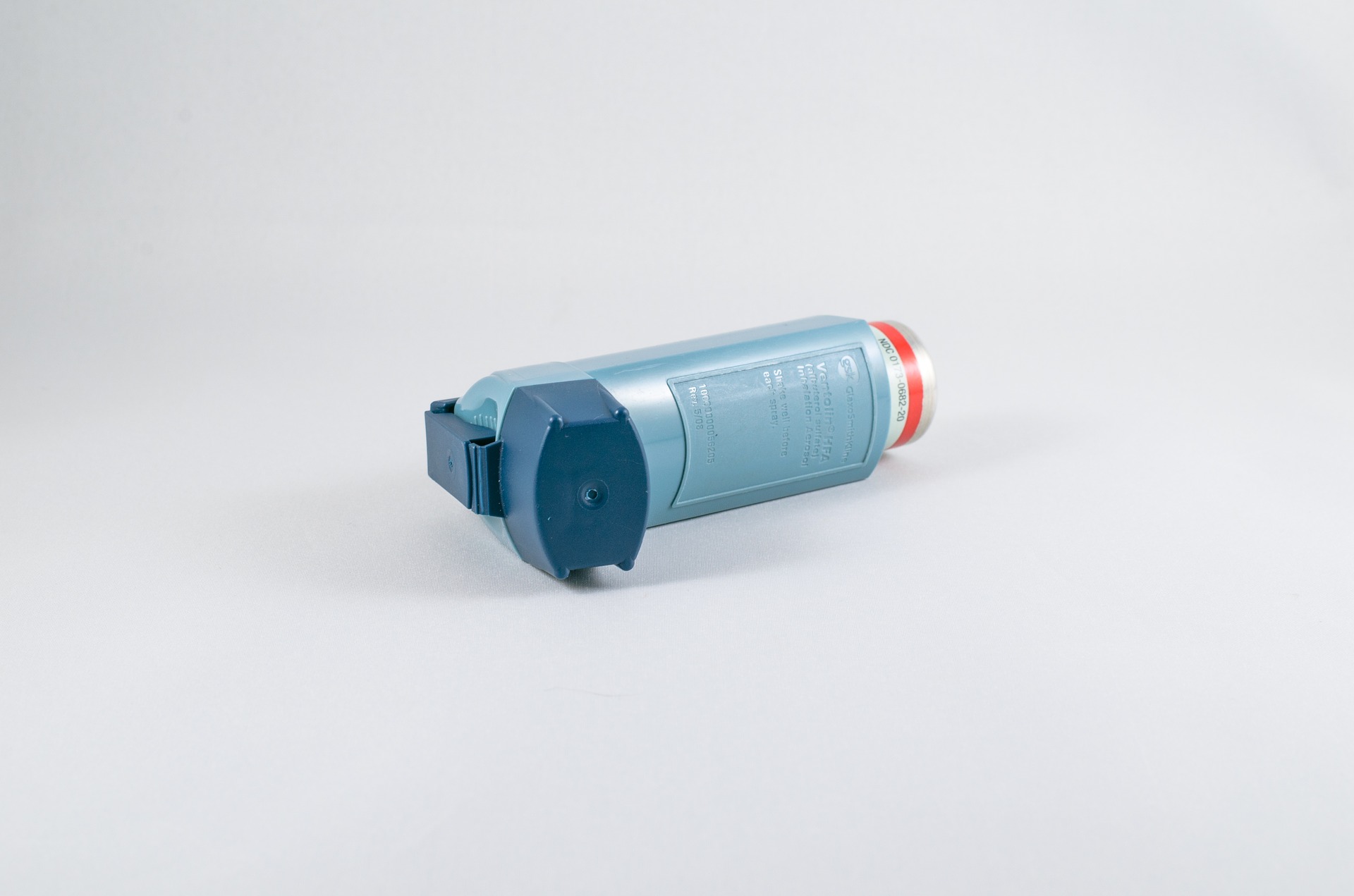 an inhaler on white table, one of the most common asthma medications